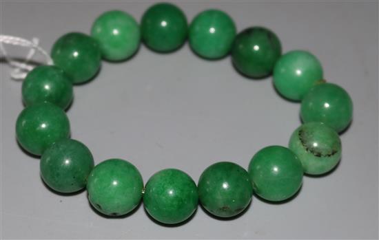 A jade bead bracelet.